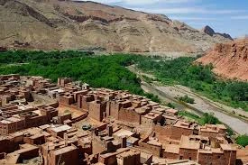 Travelers enjoying authentic Moroccan tea experience in the desert